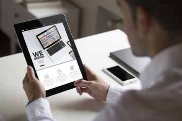 businessman we design with tablet pc