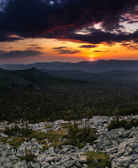 Obraz premium Colorful and dramatic natural sunrise in the wild rocky mountains of the Urals