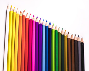 Coloured pencils lined up in a descending fashion