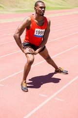 Obraz premium Athlete warming up on the running track
