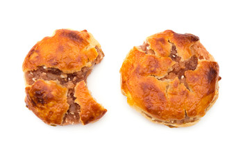 top view sweet mini chewy cakes or chickee cakes with one bited and one complete on white background