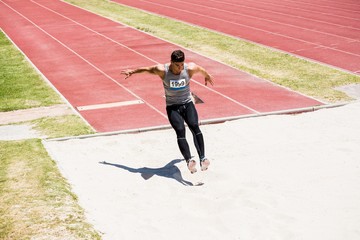 Athlete performing a long jump