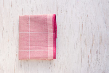 Close up hand hole linen tablecloth in red checkered for dish,