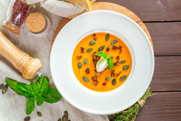 Pumpkin soup in white plate