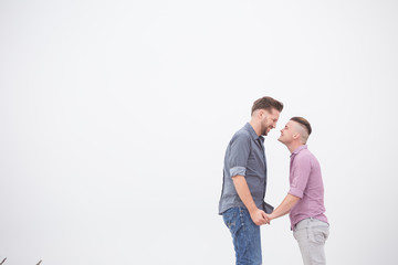 Close up image of a same sex or Gay male couple being loving and