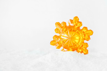 Christmas decorations in the form of a snowflake in the snow