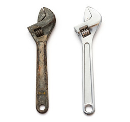 a rusty and a good wrenches on white background