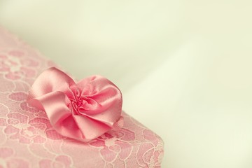 Pink lace gift box with a flower and floral ornament