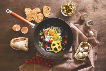 Scrambled eggs with vegetables in a skillet