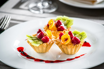 Cake dessert fruity berry cream on a plate
