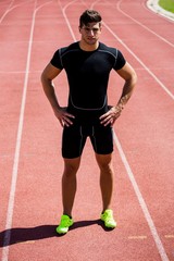 Obraz premium Athlete standing on running track