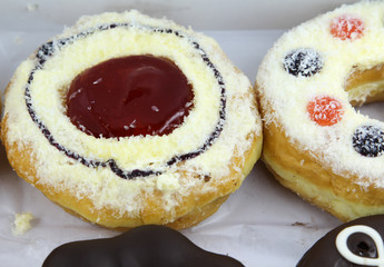 Closeup image of assorted sweet donuts.