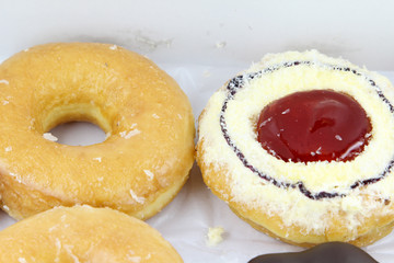 Closeup image of assorted sweet donuts.