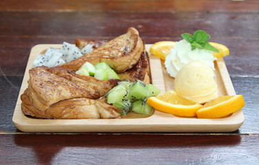 Honey toast : French toast , fresh fruit and ice cream with caramel sauce.
