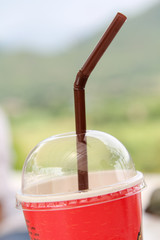 Empty plastic take-home cup of ice coffee.