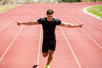 Obraz premium Athlete running on running track