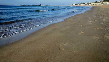 Footprints on the beach sand