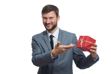 Bearded businessman holding a present