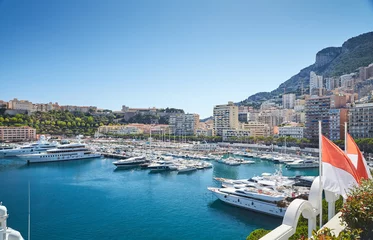 Acrylic prints Port Monaco, Monte-Carlo, Monaco Ville, 8 August 2016: Port Hercules, the preparation of the yacht show MYS, sunny day, many yachts and boats, RIVA, Prince's Palace of Monaco, megayachts, Massif of houses