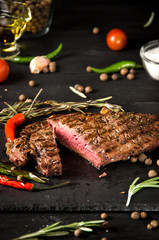 rare steak black square plate spices slate