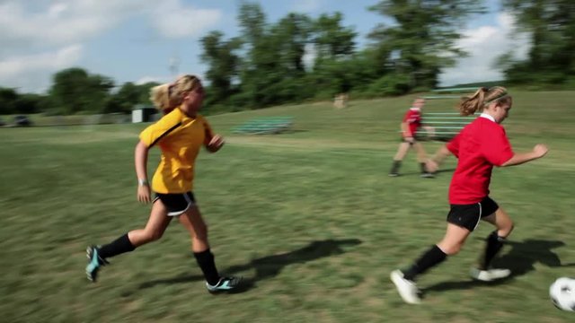 Teenage girls playing soccer