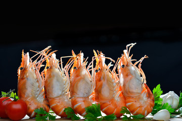 Cooked shrimps,prawns with seasonings on stone background