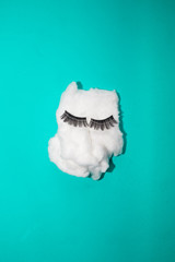 cotton with fake eyelashes for conceptual theme, colorful background