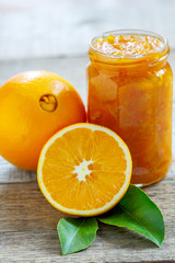 Fototapeta na wymiar Oranges and jar of jam.