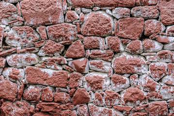 masonry texture painted of red of the walls of the Roman village of Idanha-a-velha in Portugal. 