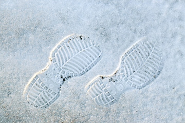 Human's foot print on a  snow