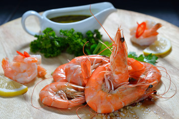 Cooked shrimps,prawns with seasonings on chopping board