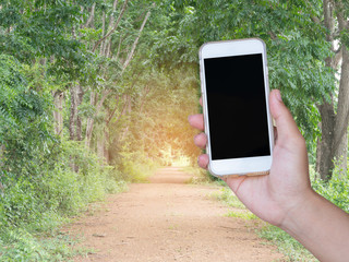 holding smart phone device. Smart phone with blank screen. GPS navigation maps concept.