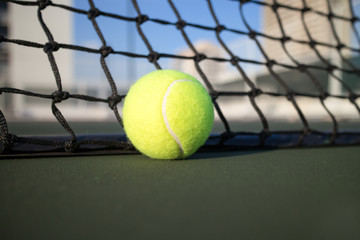 Tennis ball on hard court