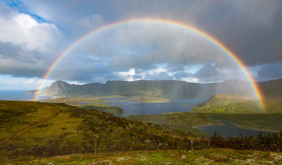 Fototapeta na wymiar Rainbow over the Bay of Bleik, Andoya, Vesteralen, Norway