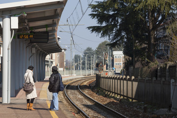 Two People waiting for the train