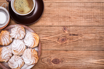 Delicious profiteroles with cream dessert.