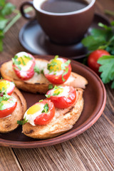 Baked eggs in tomato cups. Breakfast.
