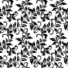 Seamless pattern with twisted branches with leaves on a white background