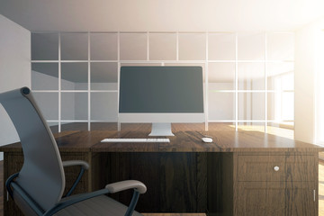 Workplace with empty computer screen