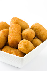 Traditional fried Spanish croquetas (croquettes) isolated on white background
