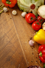 wooden background with vegetables and spices

