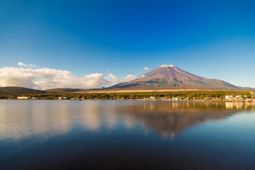 The Mount Fuji of the first snow cap.Foreground is an inverted image of Mt. Fuji  and Lake Yamanaka.