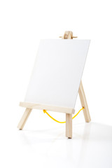 Small easel with white album sheet of paper