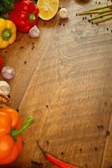 wooden background with vegetables and spices
