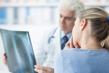Fototapeta premium Doctor examining a patient's x-ray