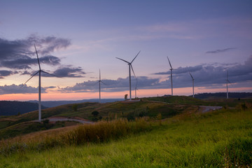 Obraz premium Wind turbine power generator at twilight