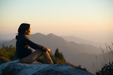 Women see sunset light and mountains view