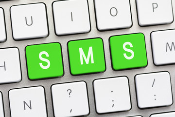 SMS writing on white keyboard