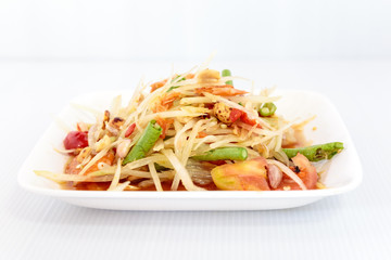 Thai food papaya salad on white dish