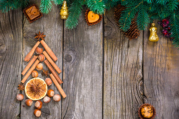 Christmas tree made of nuts, spices and dried oranges. Viewed from above